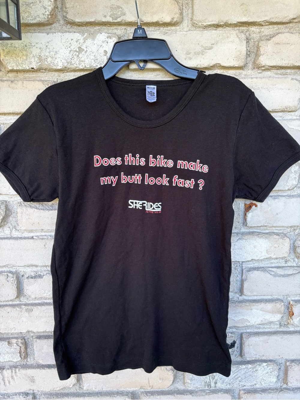 She Rides Black Short-Sleeve Graphic Tee-Does this bike make my butt look fast?